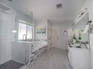 large bright bathroom with tile and granite