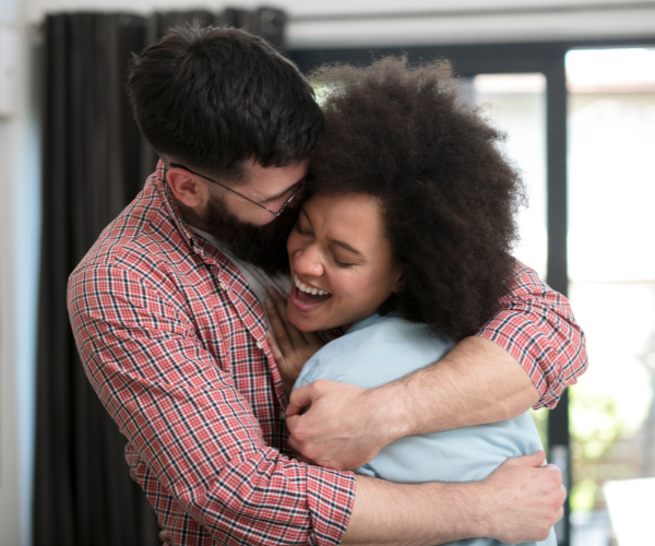 asher-buys-houses-we-buy-houses-san-diego-happy-couple-hugging-after-they-were-able-to-sell-their-house-for-cash