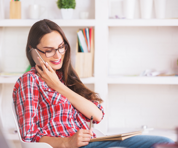 asher-buys-houses-we-buy-houses-san-diego-woman-on-phone-taking-notes-for-an-all-cash-offer-to-sell-home-fast