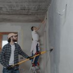 couple repairing their home