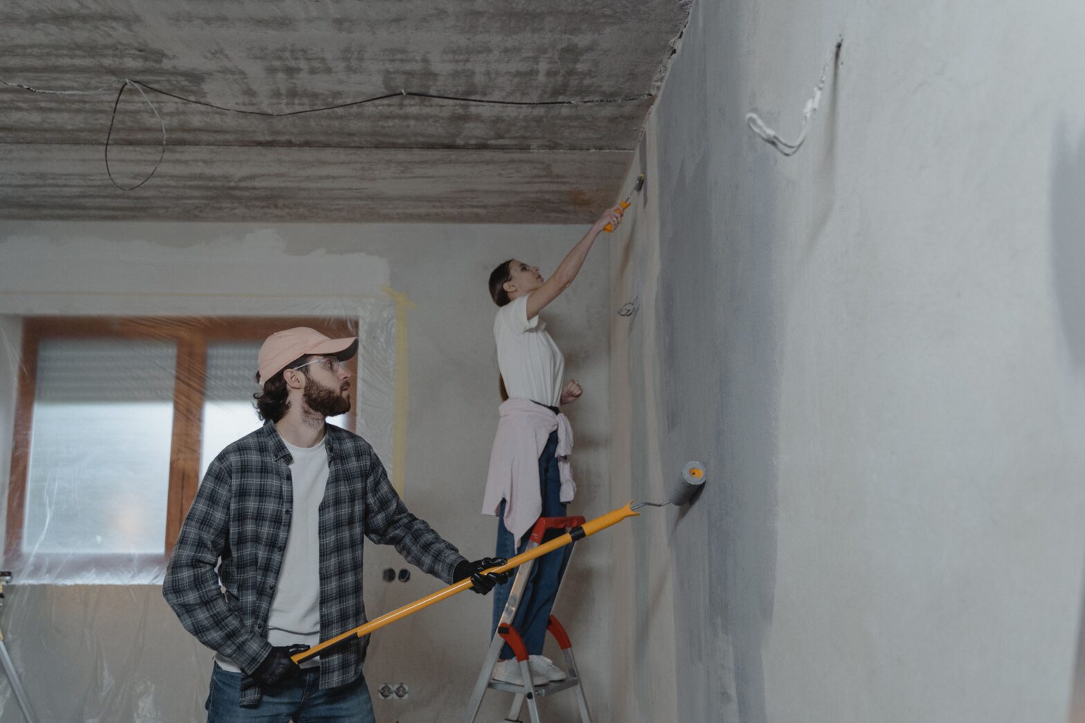 couple repairing their home