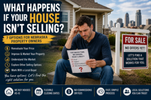 Concerned Nebraska property owner sitting outside a house with a "For Sale" sign after receiving no offers, illustrating options for homeowners whose property isn't selling.